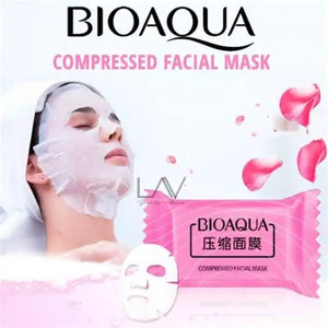BIOAQUA compressed facial mask packaging with a woman wearing a mask and pink flower petals.