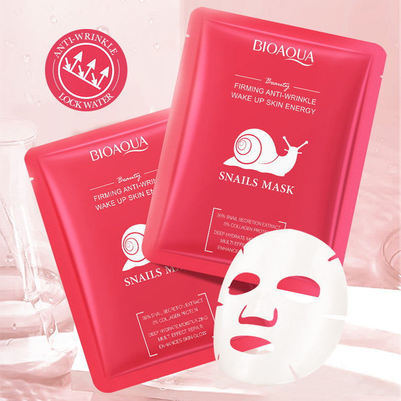 Two red BIOAQUA snail mask packages with a white mask on a pink background.