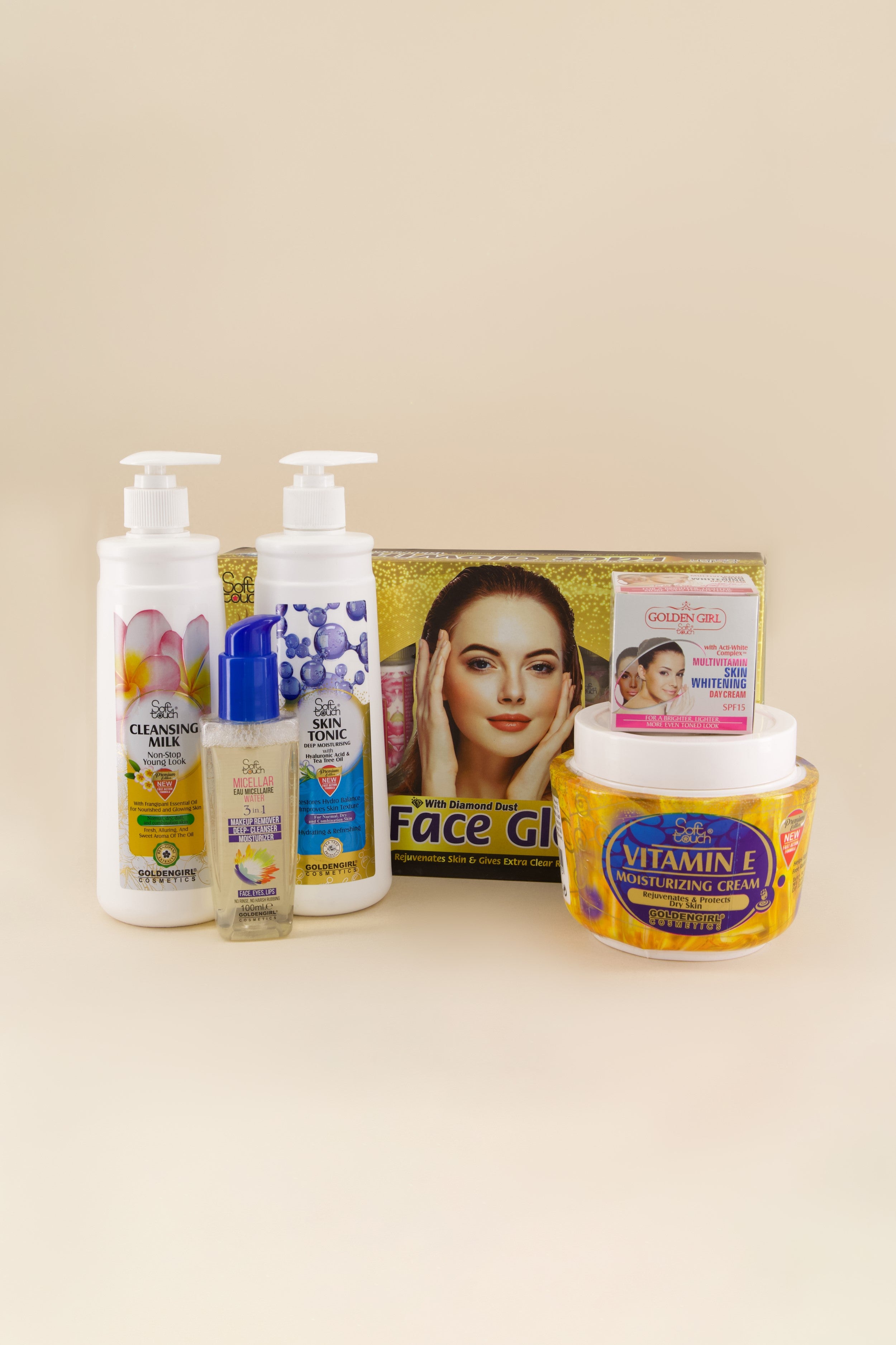 Collection of skincare products including bottles and a jar on a beige background