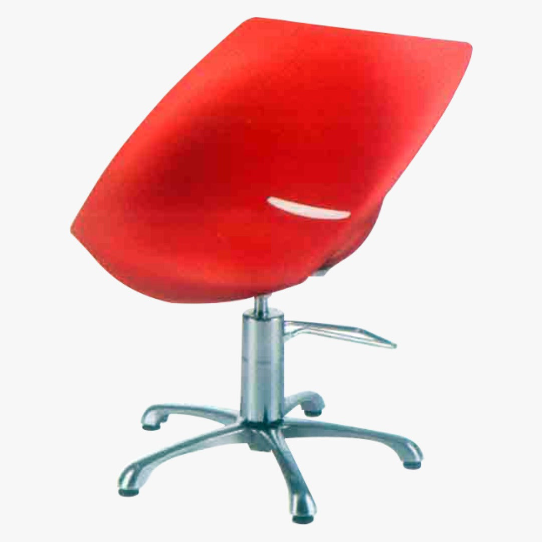 A modern red salon chair with an adjustable headrest and extra-wide seat, featuring a chrome side lever and a five-point wheeled base.