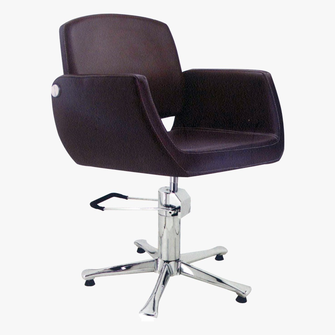 A black upholstered salon chair with a chrome base and hydraulic pump, featuring an adjustable headrest and extra-wide seat.