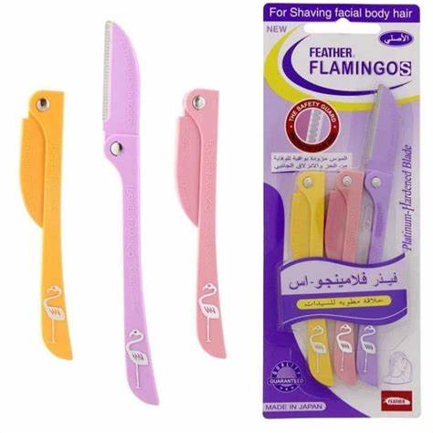 Packaging and product display of Flamingo brand safety razors for face and body shaving, showing three individual razors in pink, yellow, and orange, with the product name and 'Made in Japan' label.