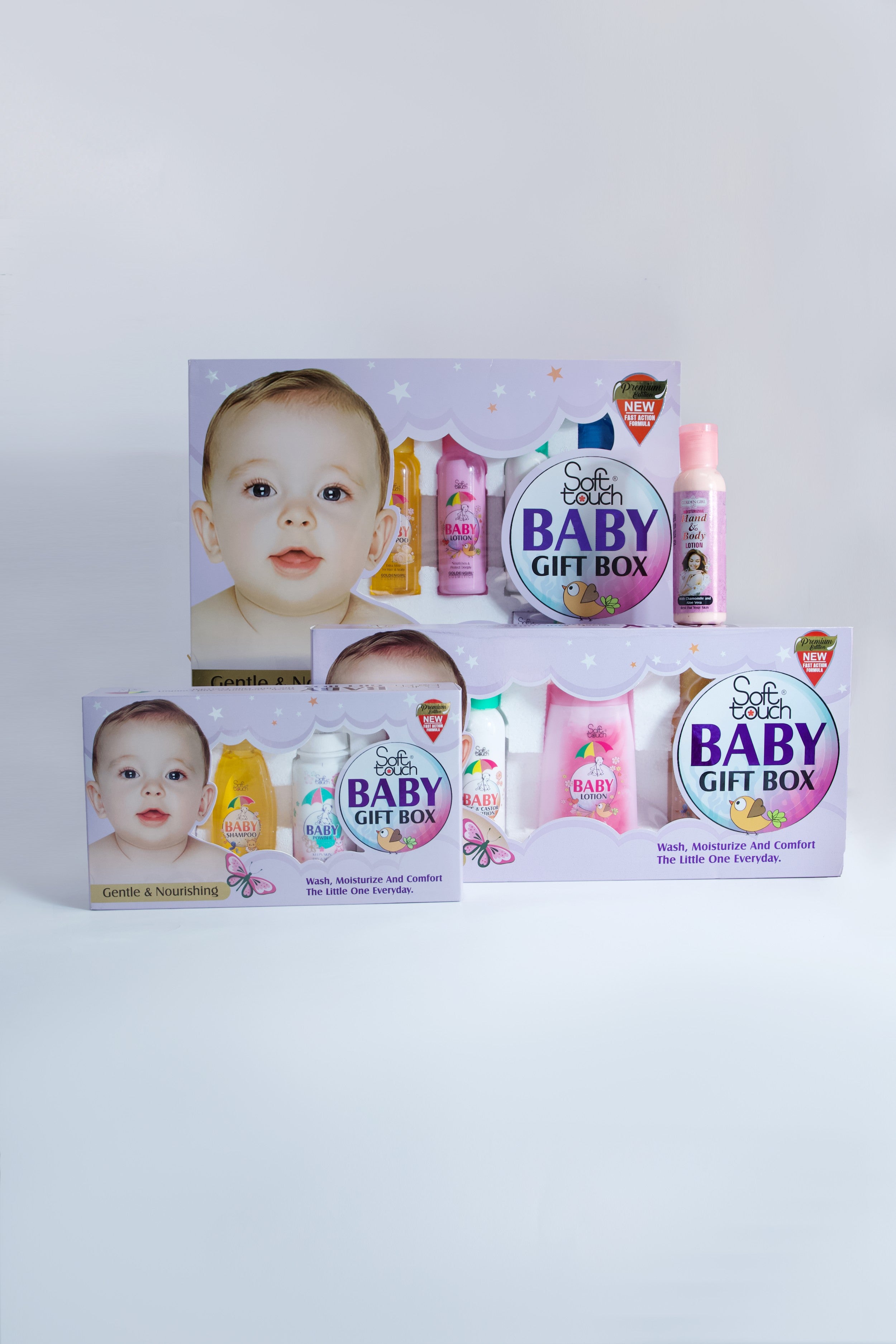 Baby gift box set with various items on a white background