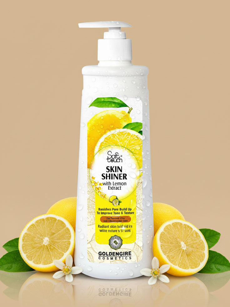 Bottle of GoldenGire Skin Shiner with Lemon Extract on a beige background with lemons and leaves.