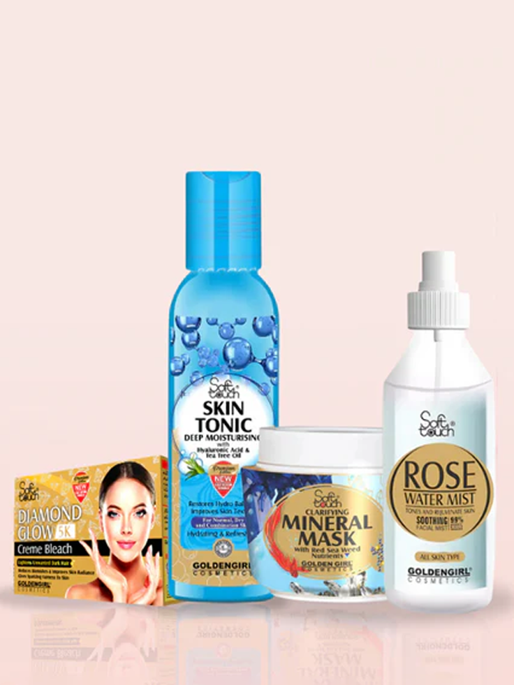 Collection of skincare products including a bottle, cream, and mask on a light pink background