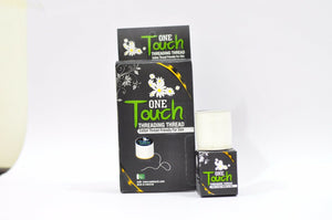 A box and a roll of threading thread with packaging labeled 'One Touch' by Oxolane. The thread is meant for hair removal and is made from cotton.