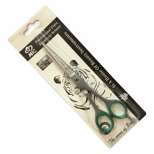 A pair of hair cutting scissors made of stainless steel, packaged in a blister pack with a logo and product information.