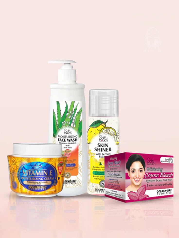 Set of skincare products including a face wash, cream, and box on a light pink background