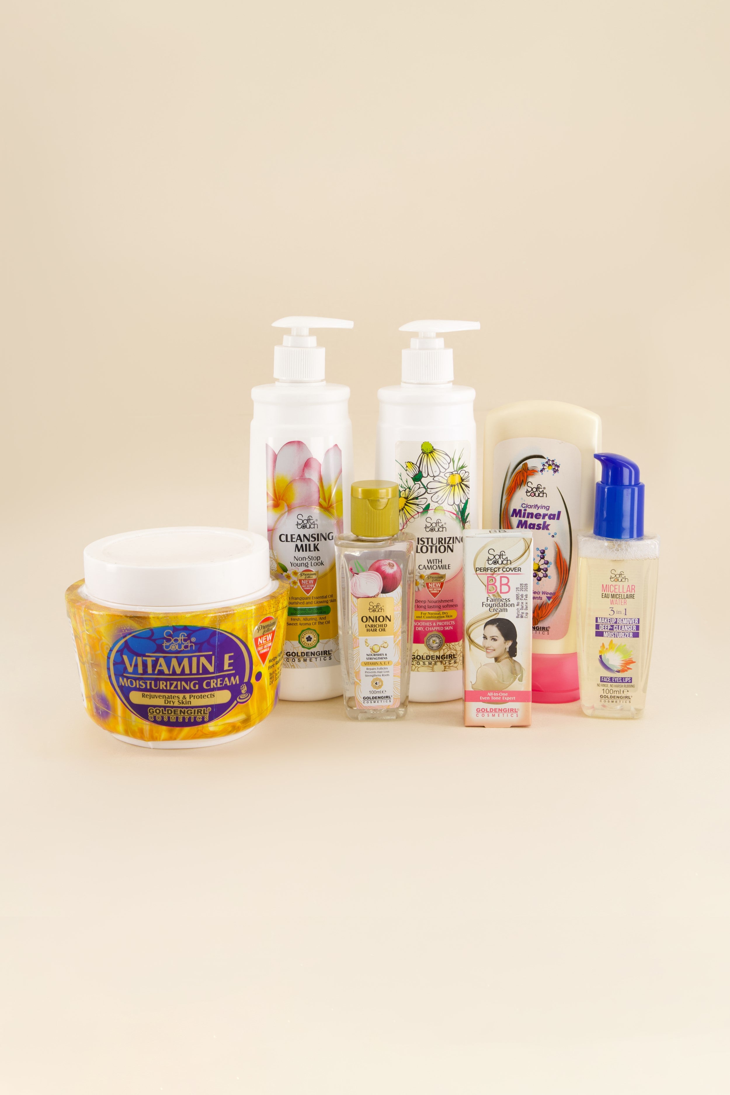 Collection of skincare products on a beige background