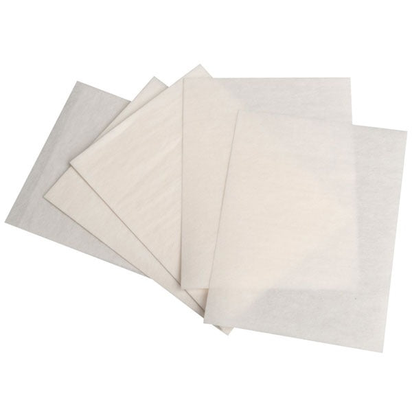Stack of white end papers for hair salons.